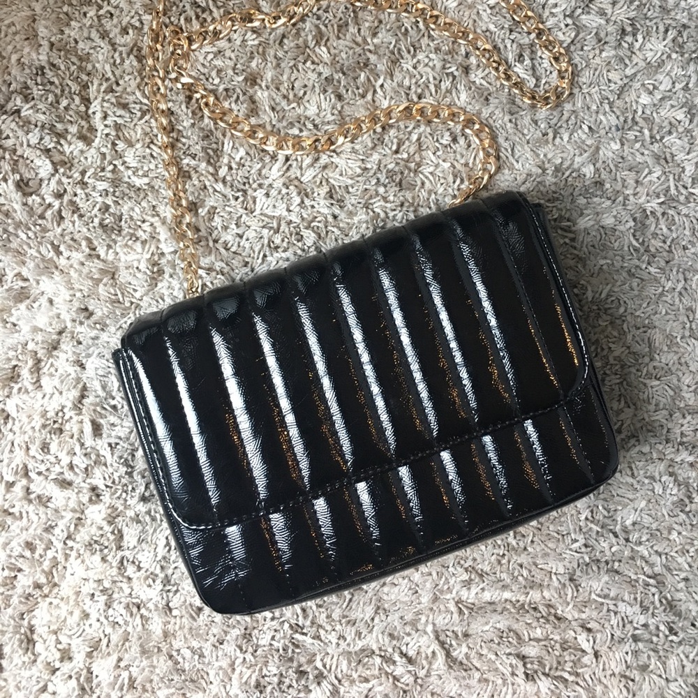 Shiny black purse w/ gold detailing